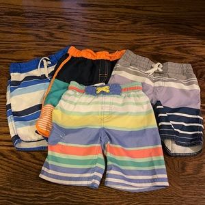 Lot of 4 swim shorts for boys great condition size 4/5 and XS (5)